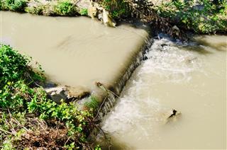 Polluted Stream Of Dirty Water