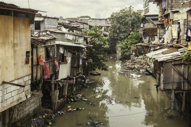 Shacks Along Polluted Canal