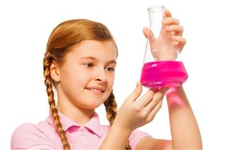Young Chemist Pouring Reagent In Glass