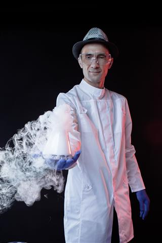 Smiling Man Scientist With Dry Ice