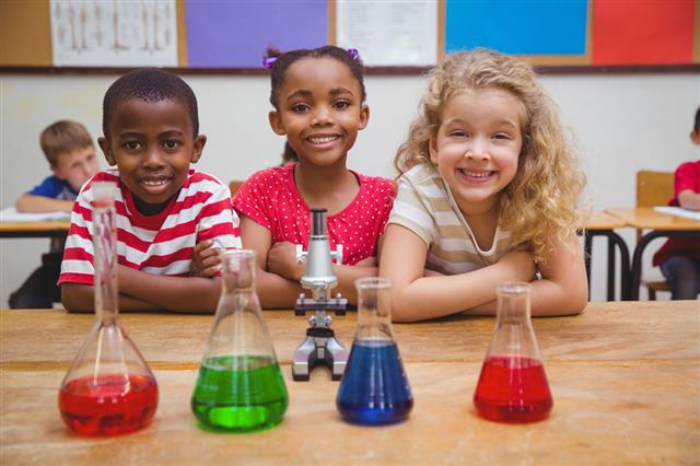 Students And Colorful Lab Beakers