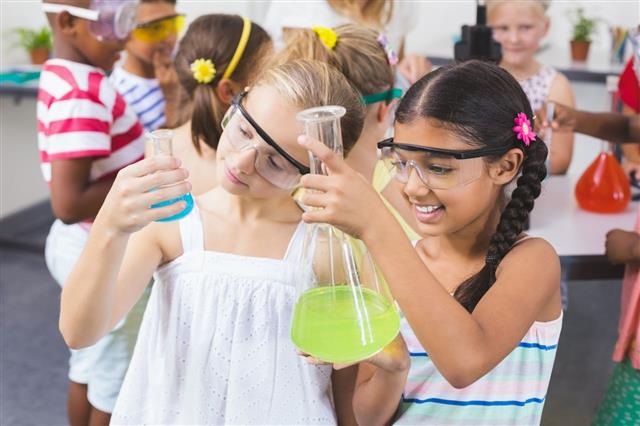 Kids Doing A Chemical Experiment
