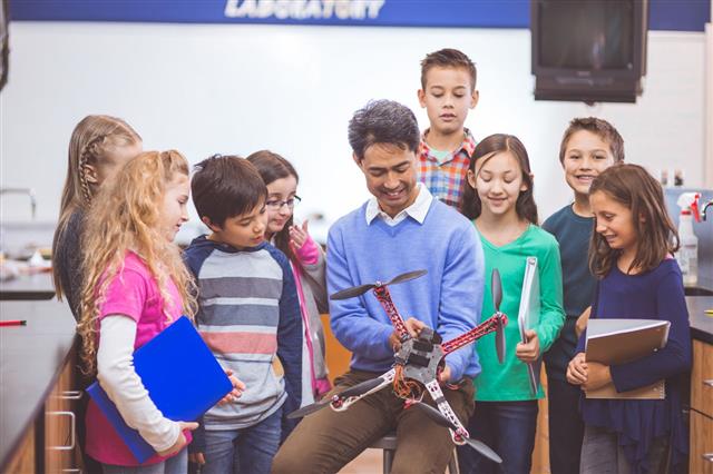 Students Looking Drone In Classroom