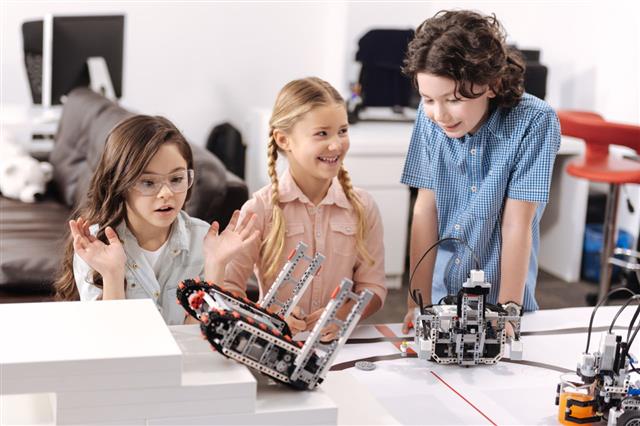Pupils Testing Electronic Robots At School