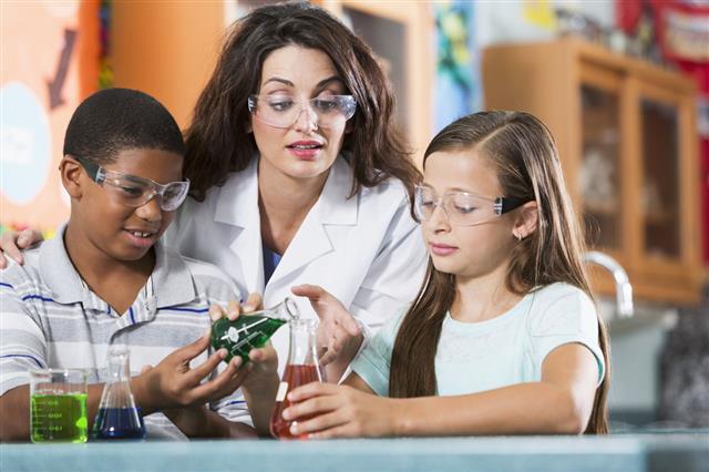Teacher And Students In Science Lab
