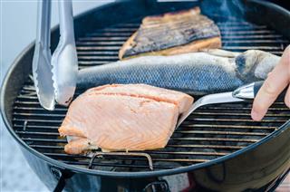 Salmon Steaks And Fish On Grill