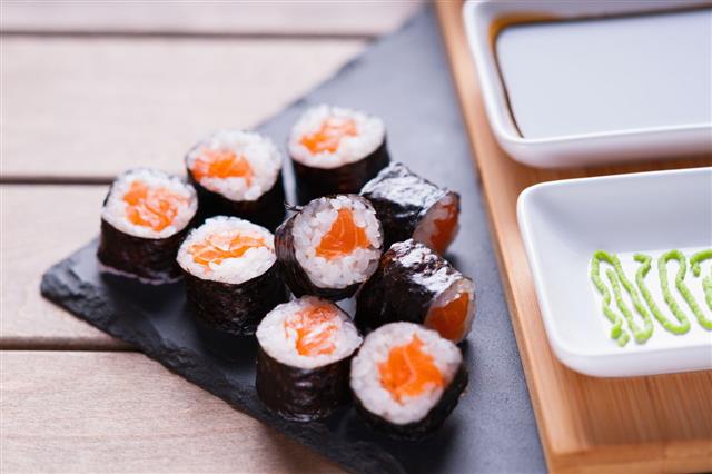 Sushi Rolls With Salmon And Soy Sauce