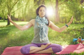Serene and peaceful woman practicing mindful awareness