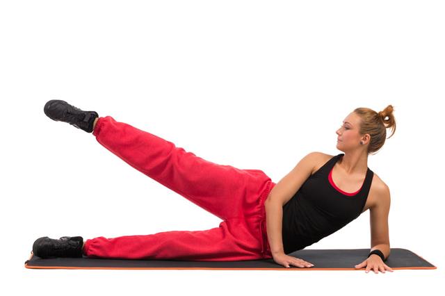 Female Stretching On Aerobic Mat