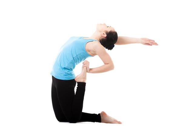 Yogi female in yoga asana Ustrasana
