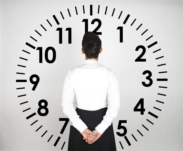 Business Woman Looking Clock