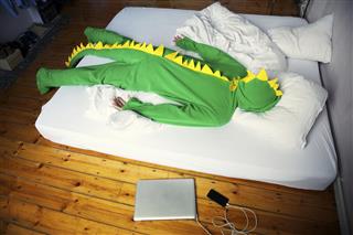 Man Passed Out Morning After Late Night in Dinosaur Costume