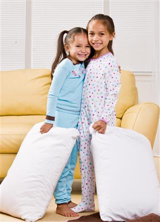 Girls wearing pajamas in living room