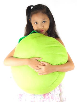 Girl holding a green pillow.