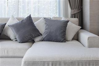 Modern white sofa with black and white pillows