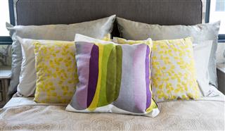 Colorful pillow on bed