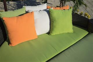 Outdoor pillows on sofa under brilliant sunlight