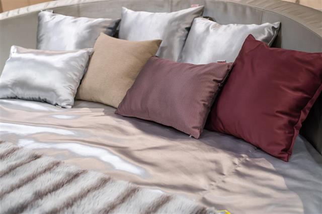 Colorful pillows on gray sofa