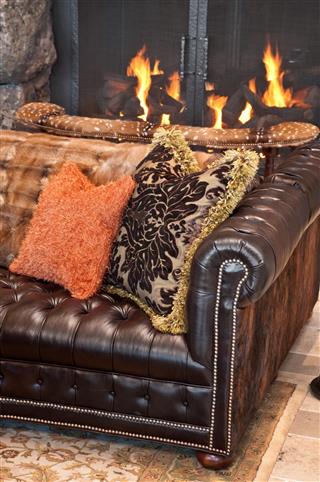 Close up of couch and fireplace