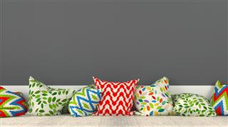 Colorful cushions and a gray wall