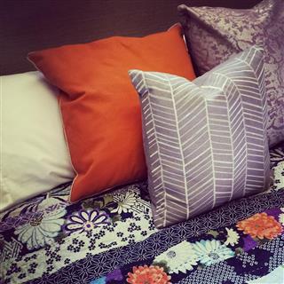 Colorful pillows on a bed