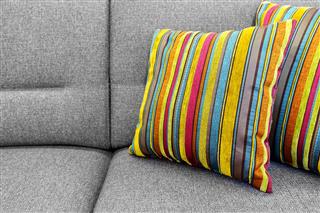 Gray Sofa With Colorful Striped Pillows