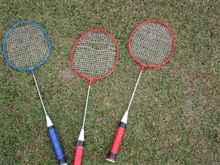 Badminton Rackets On A Lawn