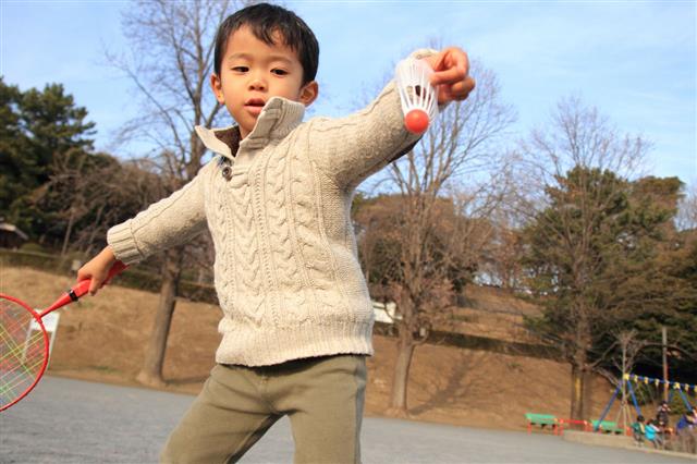 Boy Playing Badminton