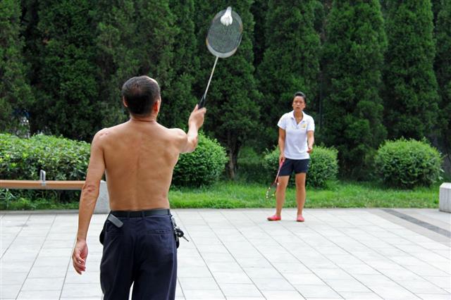 Badminton Game In The Park