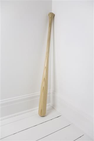 Baseball Bat Leaning Against Wall