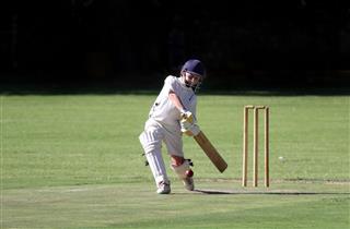 Young Boy Playing Cricket