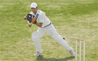 Cricket Wicketkeeper Catching A Ball