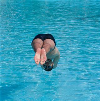 Swimmer Jumping Into Water