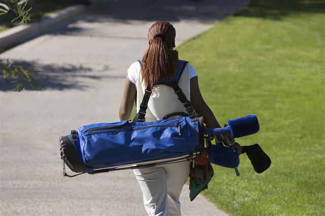 Woman Carrying Golf Club Bag