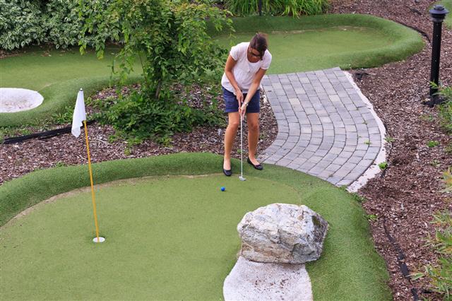 Women Playing Miniature Golf