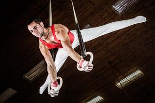 Male Sportsman On Gymnastics Rings
