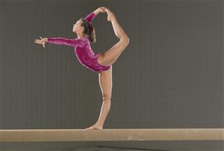 Young Gymnast On Balance Beam