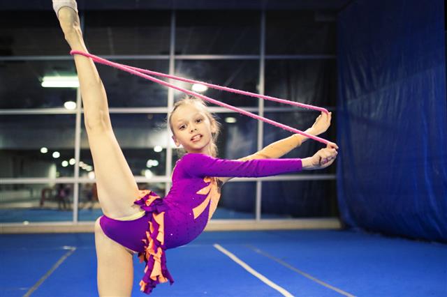 Girl Performing Rhythmic Gymnastics