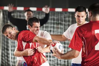 Group Of Handball Players In Action