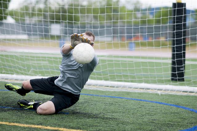 Goalie Catching A Soccer Ball