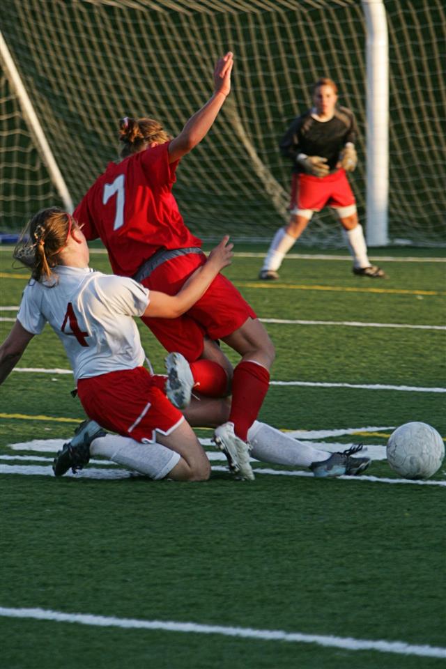 Two Soccer Midfielders Fight For Ball