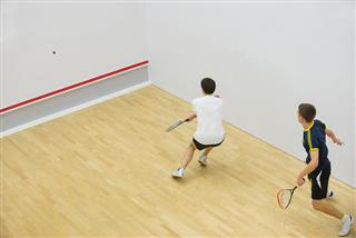 Two Men Playing Match Of Squash