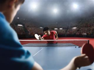 Two Players Play Table Tennis