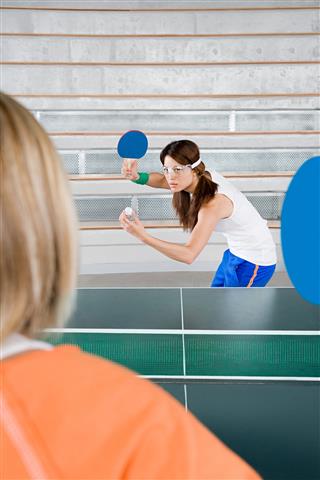 Two Women Playing Table Tennis
