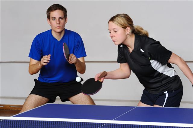 Attractive Female Table Tennis Player Serving