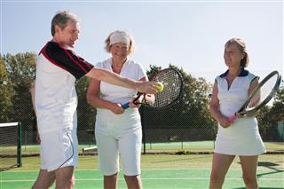Adults On Tennis Court