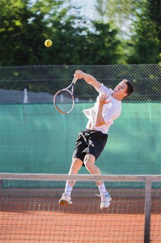 Tennis Player At Smash