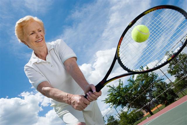 Senior Woman Playing Tennis