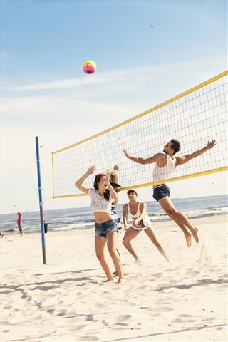 Friends Playing Beach Volleyball