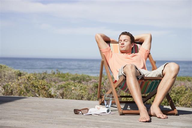 Man Relaxing In A Lounge Chair